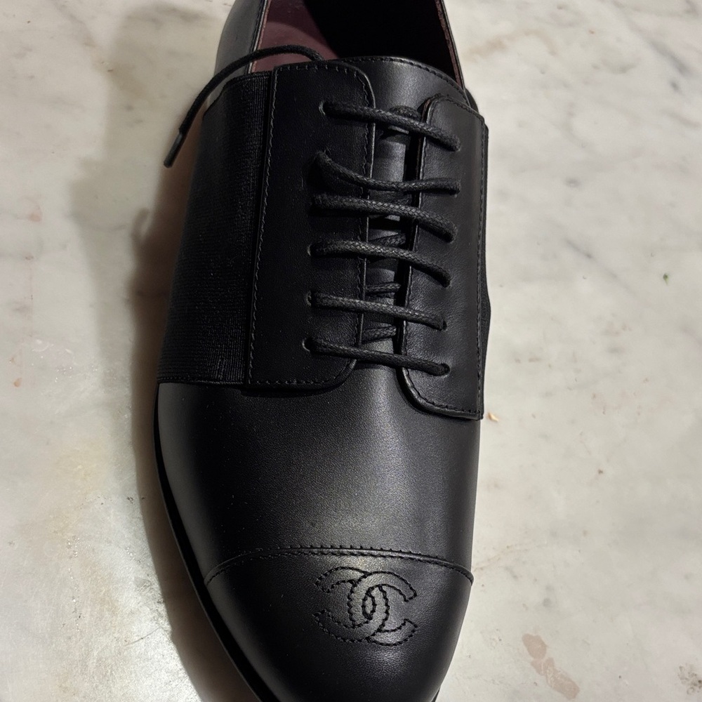 CHANEL Black Leather Lace-Up Loafers with Embossed CC